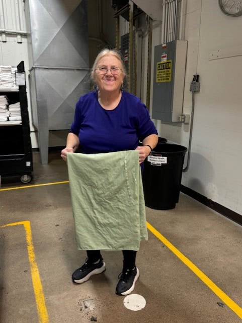 Smiles while working Marie laundry 12 25 - Winona ORC