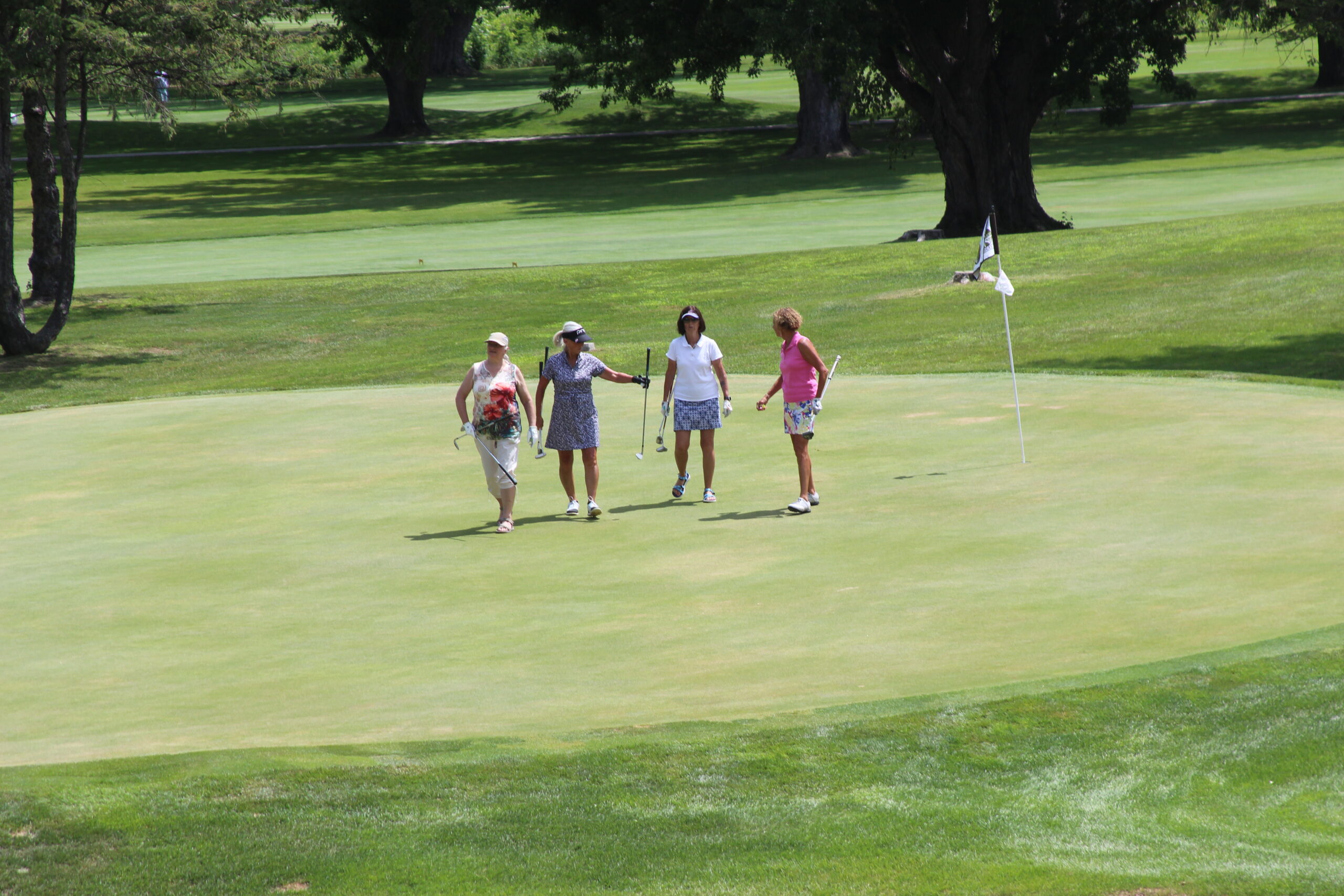 Media 25 4 women walking off green