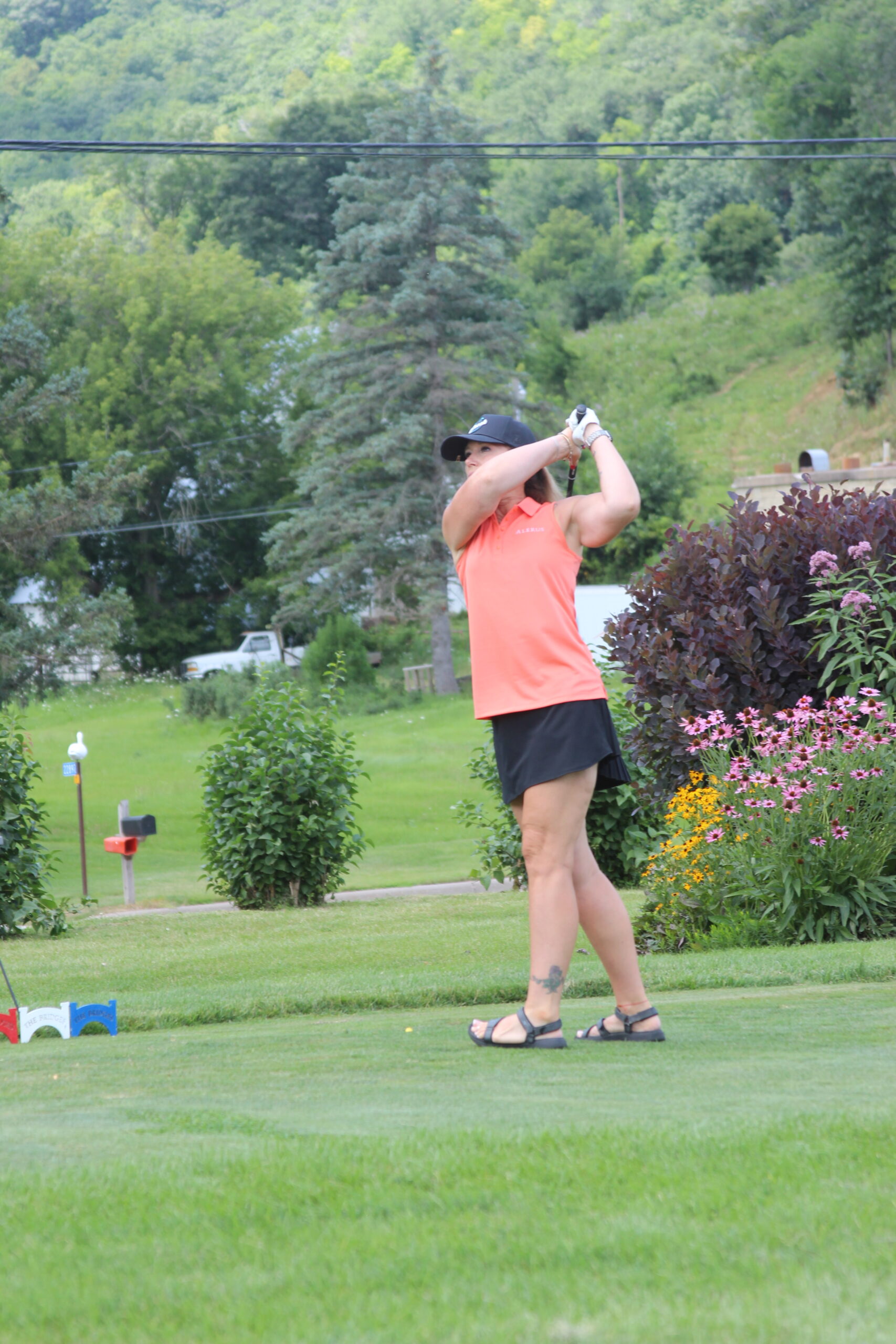 Media4 Woman taking a golf swing