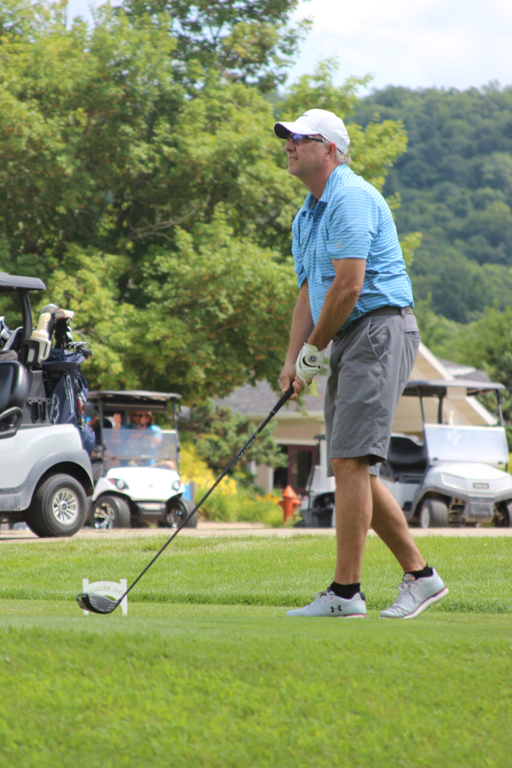 Media8 man making a golf drive