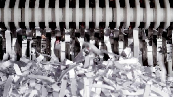 Shredding-machine- Close-up of shredding machine shredding paper